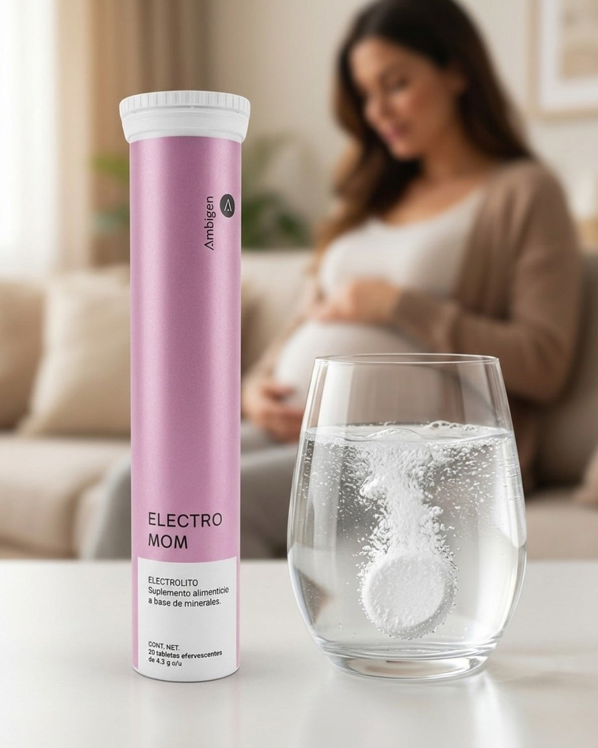 ELECTRO MOM junto a un vaso con tableta disuelta